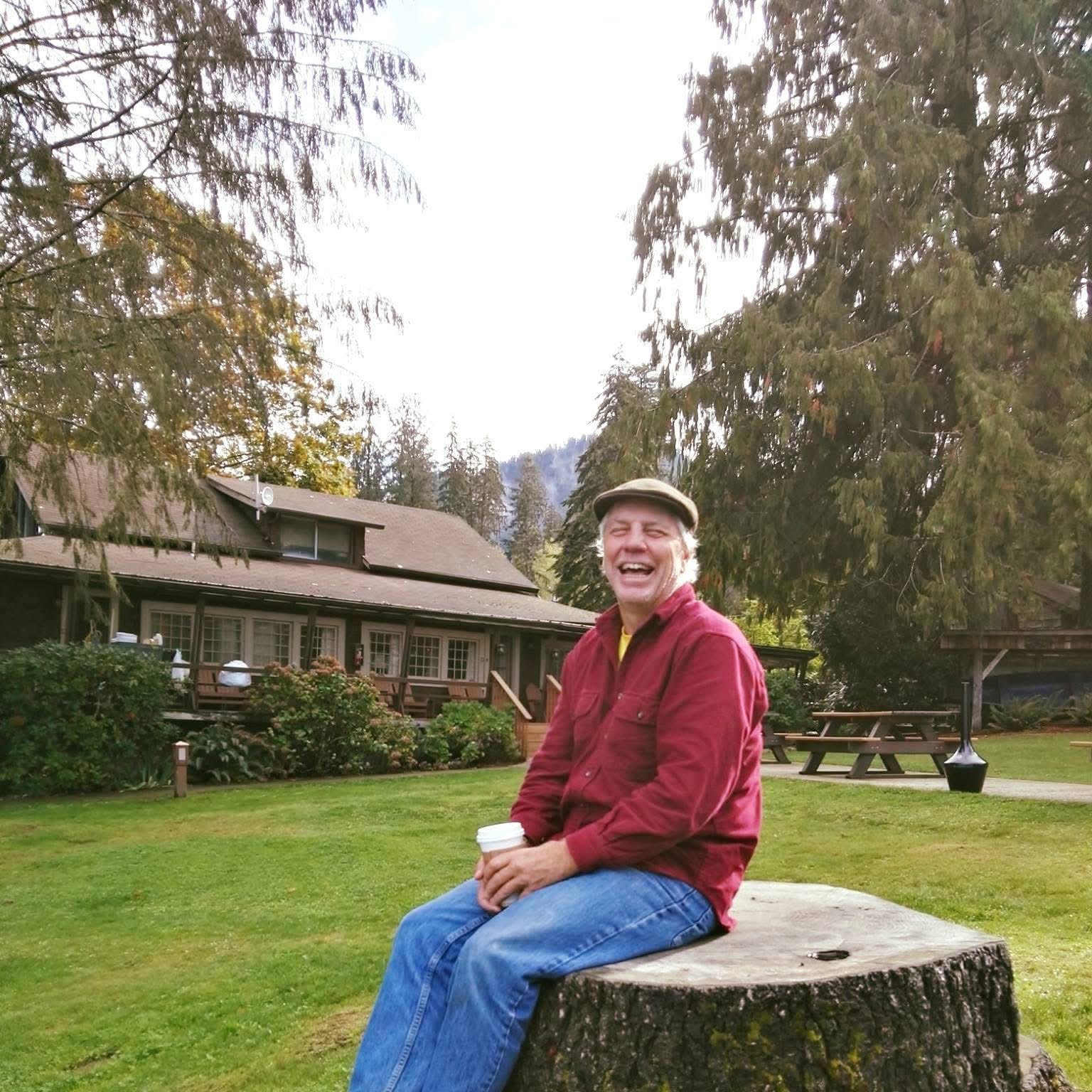 Paul outside a National Park, with coffee in hand